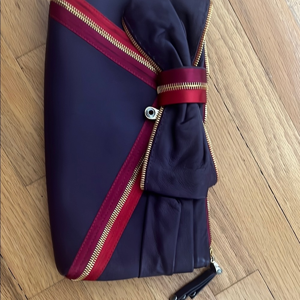 Henri Bendel Purple and Red Clutch with Bow Detail